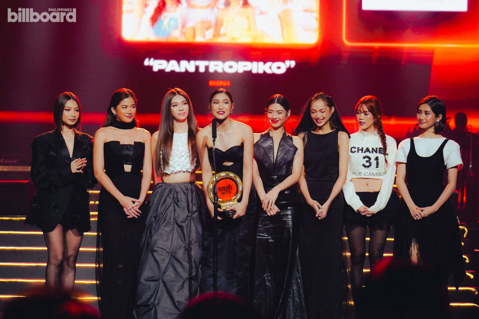 BINI receiving award on stage black dresses