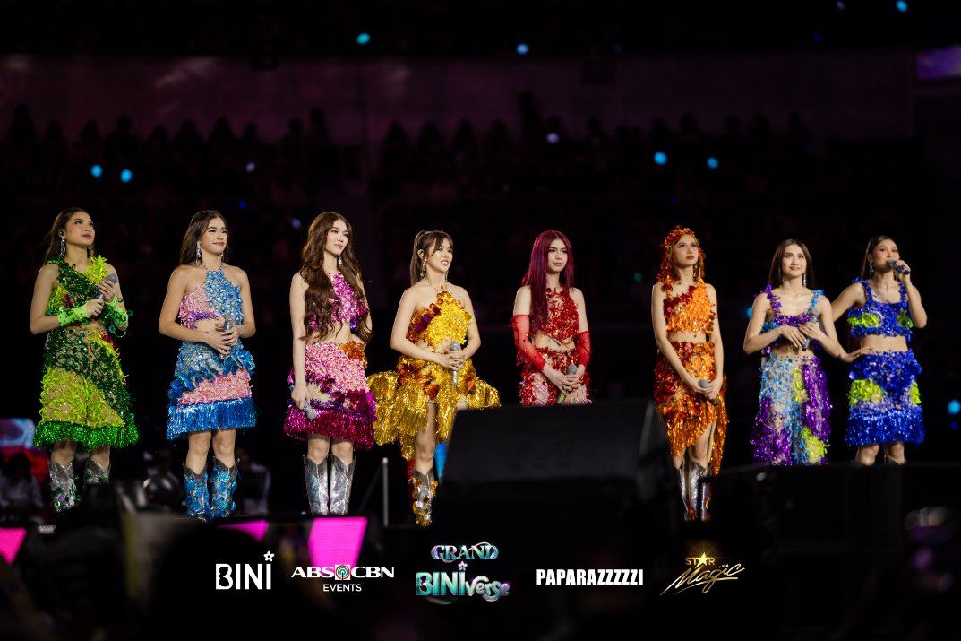 BINI performing on stage in a large venue